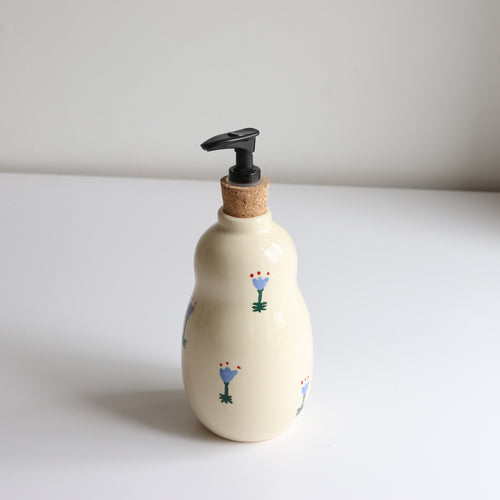 Curvy floral soap dispenser