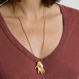 Gilded hand necklace